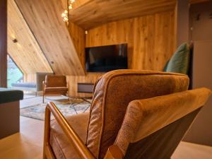 TV a/nebo společenská místnost v ubytování Apartment Máj-7 by Interhome