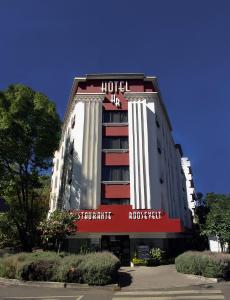a hotel building with a sign on the front of it at Hotel Roosevelt Condesa in Mexico City