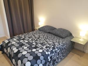 En eller flere senge i et værelse på Appartement 3 Chambres