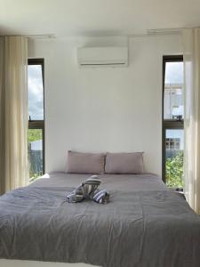 Ein Bett oder Betten in einem Zimmer der Unterkunft Villa Trou d'Eau Douce
