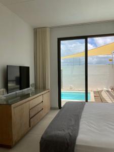 Ein Bett oder Betten in einem Zimmer der Unterkunft Villa Trou d'Eau Douce