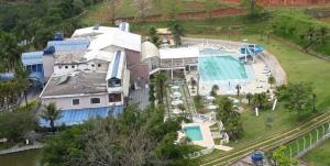 an aerial view of a large house with a swimming pool at hotel fazenda encanto in Guararema