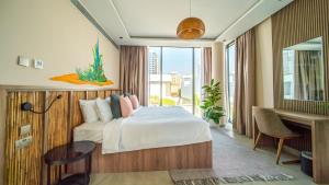 a hotel room with a bed and a window at Nas House Private Villas in Dubai