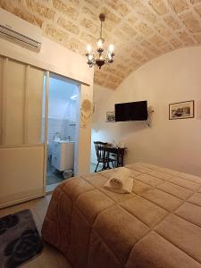 a bedroom with a bed and a television on the ceiling at SAN MARCO in Bari