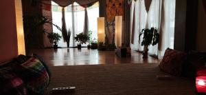 a living room with a couch and some plants at Nirvana Yoga Center in Arrecife