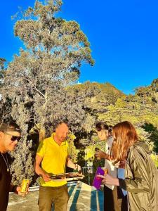 a group of people standing around with wine glasses at Las Aguas Social Experience in Bogotá