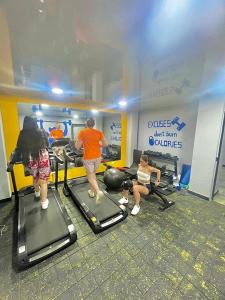 a group of people exercising on treadmills in a gym at Las Aguas Social Experience in Bogotá