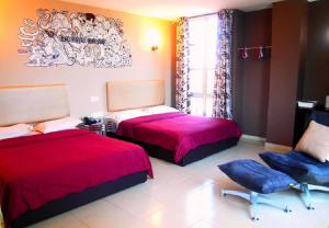 Postel nebo postele na pokoji v ubytování Angsana Hotel Melaka