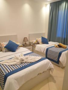 A bed or beds in a room at Sharm Hills
