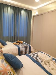 A bed or beds in a room at Sharm Hills