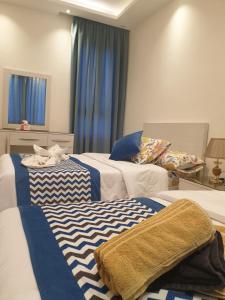 A bed or beds in a room at Sharm Hills