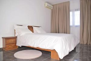 Appartement à la résidence natangué sud tesisinde bir odada yatak veya yataklar