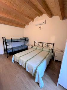 Ein Bett oder Betten in einem Zimmer der Unterkunft BILO MARIAGRAZIA