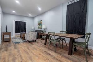 a dining room with a table and chairs at MTM Fully Furnished Rental in Old Town - 2 beds in Chicago