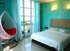 Postel nebo postele na pokoji v ubytování Angsana Hotel Melaka