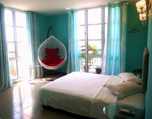 Postel nebo postele na pokoji v ubytování Angsana Hotel Melaka