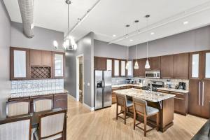 a large kitchen with a island in the middle at Lovely 2-Bedroom Unit in Springfriend in Springfield