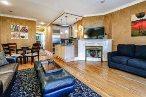 a living room with a couch and a fireplace at Brownstone 2 entire units Gold Coast in Chicago