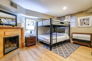 a bedroom with a bunk bed and a fireplace at Old-World Classic Building Downtown in Chicago