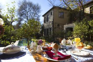 a table with plates of food on top of it at 10 Alexander B&B in Stellenbosch