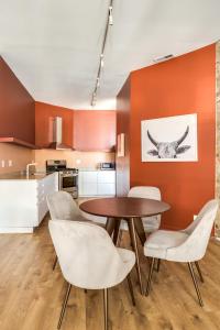 a kitchen and dining room with a table and chairs at Beautifully Remodeled Flat Downtown # 2N in Chicago