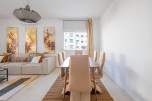 a living room with a table and a couch at Charming apartment, in heart of Agdal, 2 rooms in Rabat +18 photos