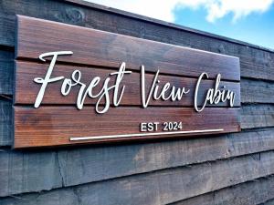 Majutusasutuses Forest View Cabin olev sertifikaat, autasu, silt või muu dokument