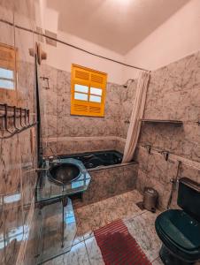 a bathroom with a sink and a toilet at Raridade em Botafogo in Rio de Janeiro
