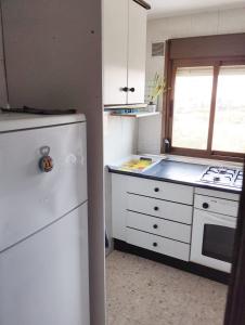 Kuchyň nebo kuchyňský kout v ubytování Casa Adriana con parking Room in shared apartment