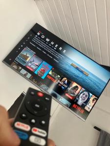 TV a/nebo společenská místnost v ubytování Hostal Del Cielo