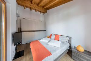 En eller flere senge i et værelse på Appartamento Le Vele - BGL + 15 billeder