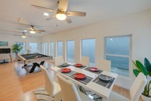 a dining room with a ping pong table and a pool table at Alligator Point Beachfront Home with Private Hot Tub in Sun N Sand Beaches