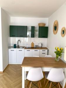 Een keuken of kitchenette bij Apartament Zielone Serce Miasta