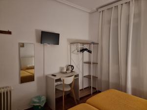 Postel nebo postele na pokoji v ubytování Casa de Huéspedes Cuenca