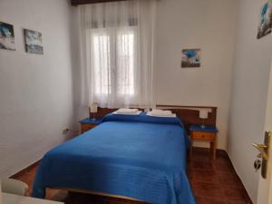 Postel nebo postele na pokoji v ubytování Casa de Huéspedes Cuenca