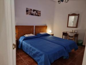 Postel nebo postele na pokoji v ubytování Casa de Huéspedes Cuenca