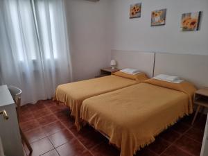 Postel nebo postele na pokoji v ubytování Casa de Huéspedes Cuenca