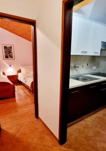 Postel nebo postele na pokoji v ubytování Nadija Rooms Funtana