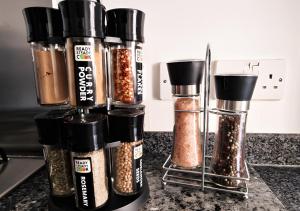 a group of spices sitting on top of a counter at The Commuter's Lodge in Laindon