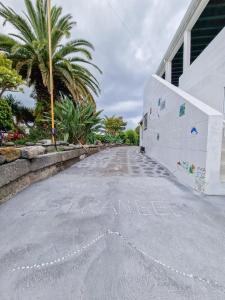 an empty street with the wordarma written on it at Loving Strangers Hostel in Madalena