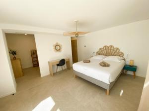 Kama o mga kama sa kuwarto sa Villa d'exception piscine privée et vue mer
