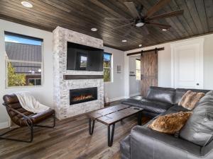 a living room with a couch and a fireplace at Deer Ridge Casita: Private Retreat Hot Tub & Views in Orderville