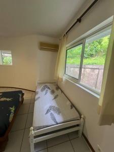 a room with a bench in a room with a window at Te Tai Marama in Uturoa +51 photos