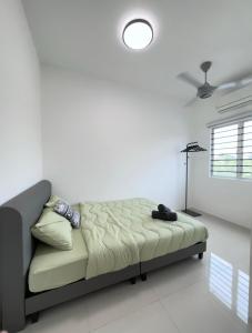 a couch in a living room with a lamp at The Moment Homestay # WIFI TV Washer in Taiping