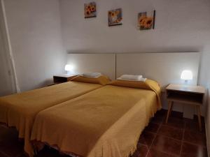 Postel nebo postele na pokoji v ubytování Casa de Huéspedes Cuenca