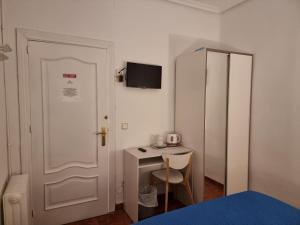 Postel nebo postele na pokoji v ubytování Casa de Huéspedes Cuenca