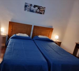 Postel nebo postele na pokoji v ubytování Casa de Huéspedes Cuenca