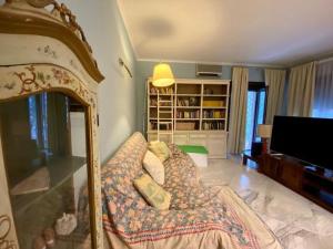 a bedroom with a bed and a tv in it at Fine and large flat with terrace, near the centre and stadium in Rome