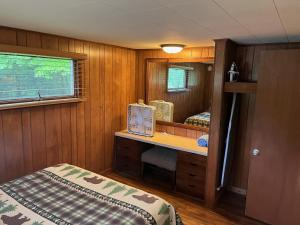 a small room with a desk and a mirror at Greenbrier Getaway #538 in Sevierville