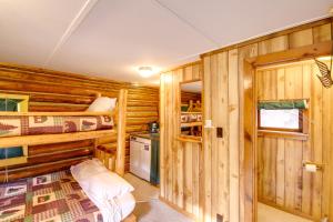 a cabin with two bunk beds and a kitchen in it at Studio Cabin on Black Diamond Ranch Hike and Fish 